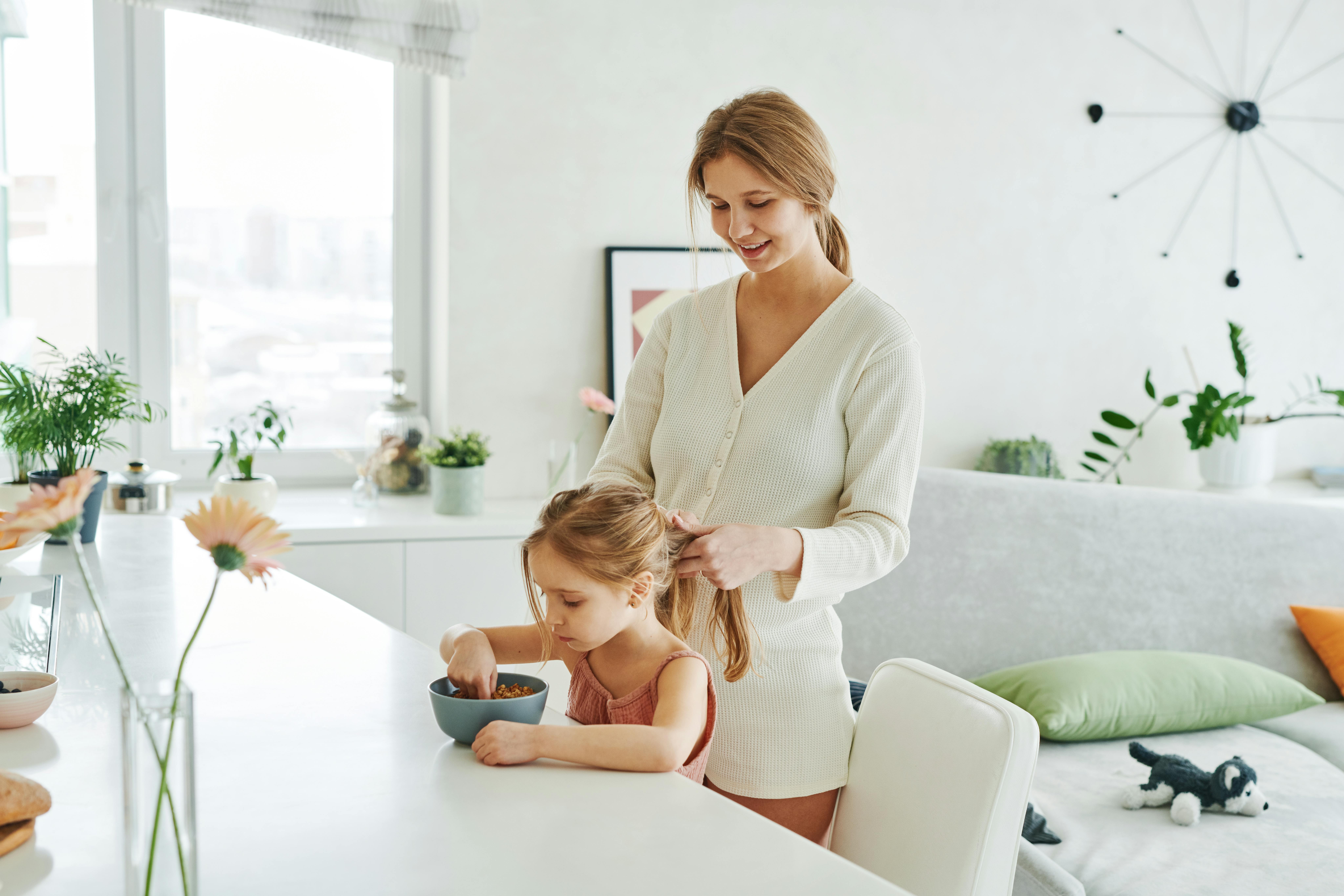 Parent patiently helping child during morning routine without rushing